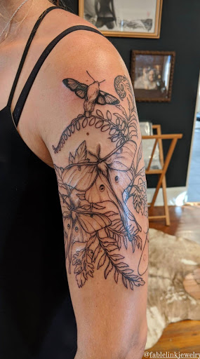 Explore small flower tattoo ideas, creative tattoo ideas in Charlotte, available at Canvas Tattoo & Art Gallery