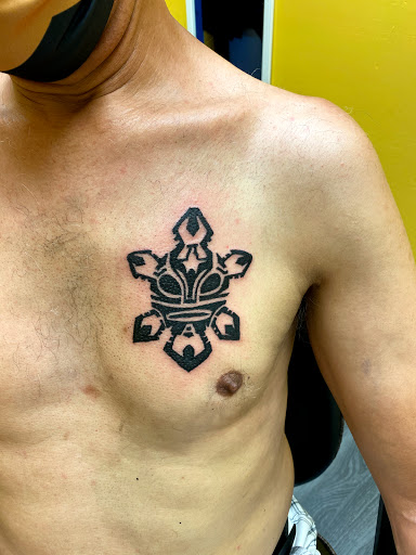 Explore chest tattoo ideas for men, creative tattoo ideas in West Babylon, available at Bizzy Empire Tattoo