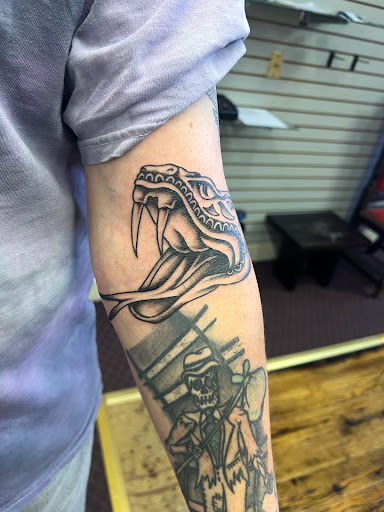 Explore george strait tattoo ideas, creative tattoo ideas in Eureka Springs, available at Sailors Luck Tattoo