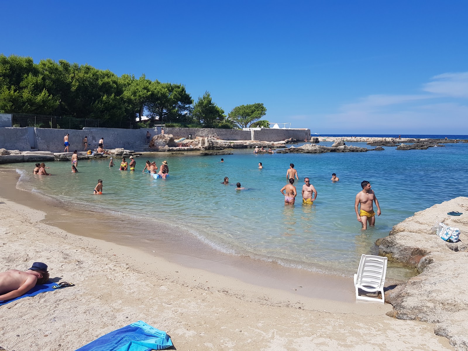 Porto Cavallo beach'in fotoğrafı parlak kum yüzey ile