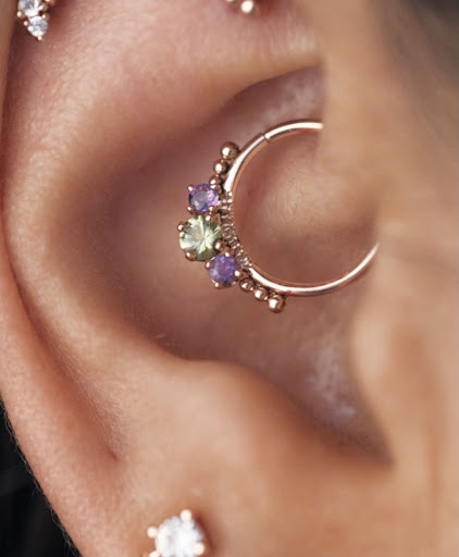 Explore tramp stamp lower back tattoo cover up ideas, creative tattoo ideas in Buffalo, available at Moria Piercing and Jewelry