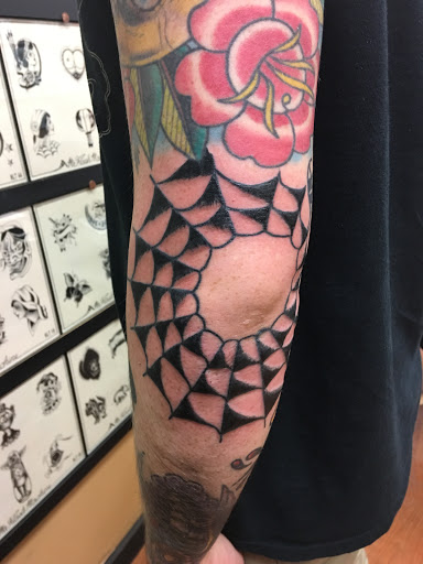 Find book of tattoo ideas for your next unique tattoo in Concord at Sterling Tattoo Club
