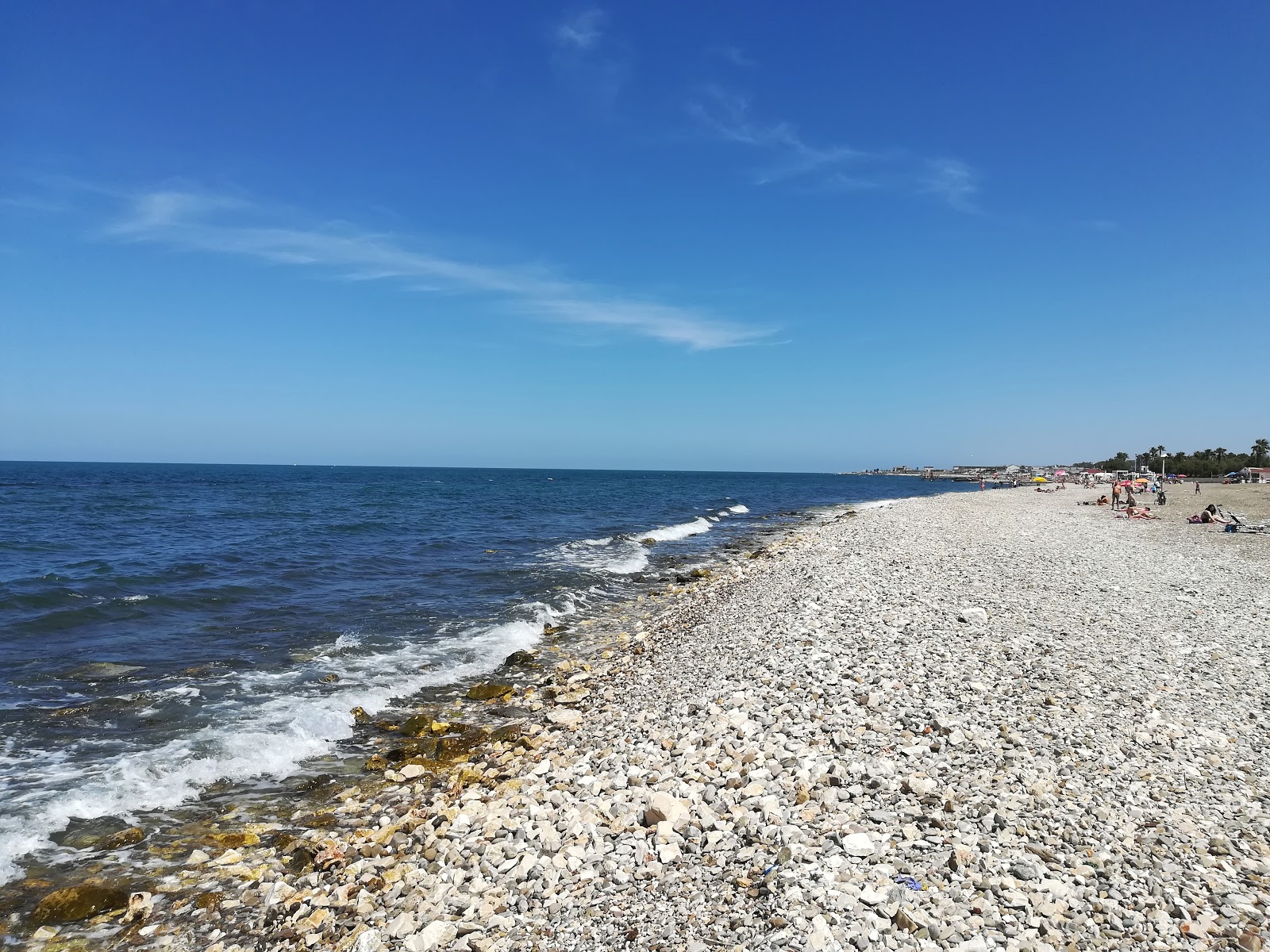 Foto di Torre Quetta beach con una superficie del ciottolo grigio