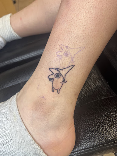 Explore minimalist dog tattoo ideas, creative tattoo ideas in Houston, available at 333 Tattoo Studio HTX
