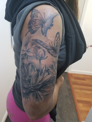 Explore january birth flower tattoo ideas, creative tattoo ideas in Jeannette, available at Damaged Legacy Studios