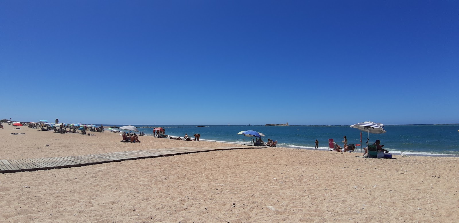 Foto von Playa de Sancti-Petri mit beiger sand Oberfläche