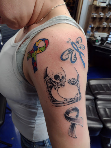 Explore stomach tattoo ideas, creative tattoo ideas in Bowling Green, available at 31 Ink Tattoo Parlor