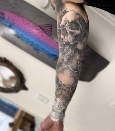 Explore small dinosaur tattoo ideas, creative tattoo ideas in New Cumberland, available at American Anchor Tattoo Co.