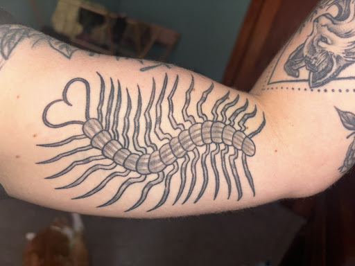 Explore upper arm men tattoo ideas, creative tattoo ideas in Olney, available at Barons Ink