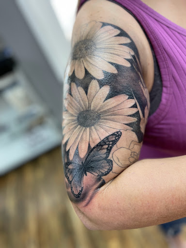 Explore left hand tattoo ideas, creative tattoo ideas in Huntington, available at Golden Dagger Tattoos and Piercings