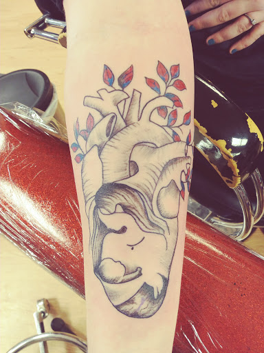 Explore female arm sleeve tattoo ideas, creative tattoo ideas in La Crosse, available at La Crosse Tattoo