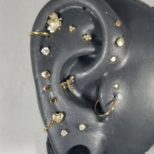 Explore tattoo ideas for scars, creative tattoo ideas in Toledo, available at Piercings by Caitlin presents Holier Toledo