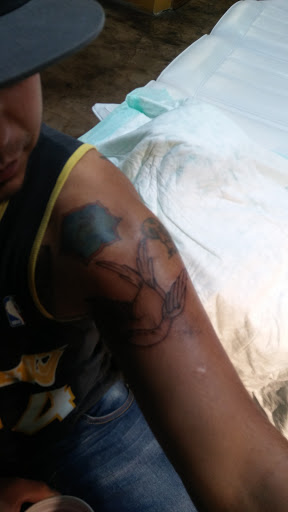 Explore knee tattoo ideas for men, creative tattoo ideas in Abilene, available at La Leyenda Tattoo Co