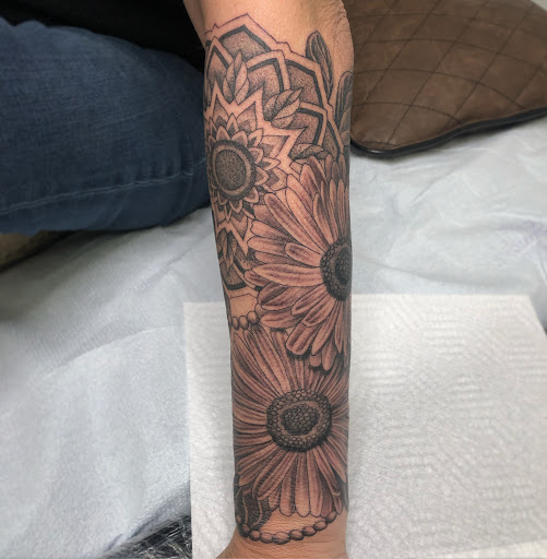 Explore spine tattoo cover up ideas, creative tattoo ideas in Menomonie, available at Kindhand Tattoo