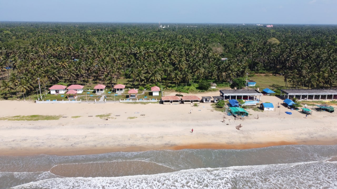 Photo of Nattika Beach with turquoise water surface