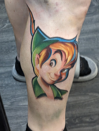 Explore rip cross tattoo ideas, creative tattoo ideas in Glendale, available at PRINCE ART AND INK