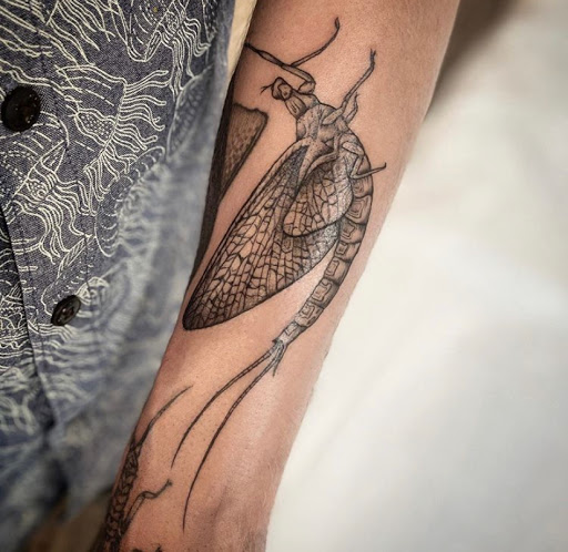 Explore earlobe tattoo ideas, creative tattoo ideas in Avon, available at Avanti Tattoo