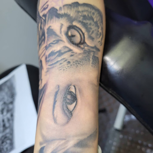 Explore dog tag tattoo ideas, creative tattoo ideas in Angola, available at Hoodlum Ink