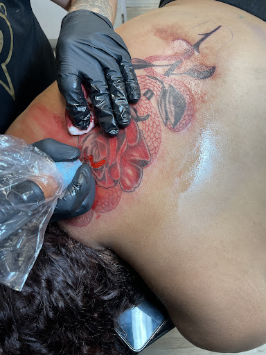 Explore open book tattoo ideas, creative tattoo ideas in Toledo, available at Artistik Tat2 and Body Piercing