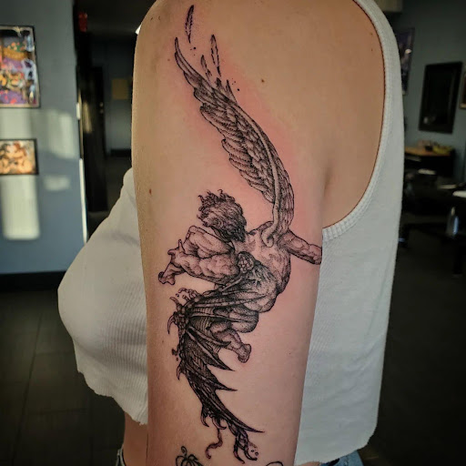 Explore arm tribal tattoo cover up ideas, creative tattoo ideas in Palm Harbor, available at Angry Owl Tattoo and Piercing