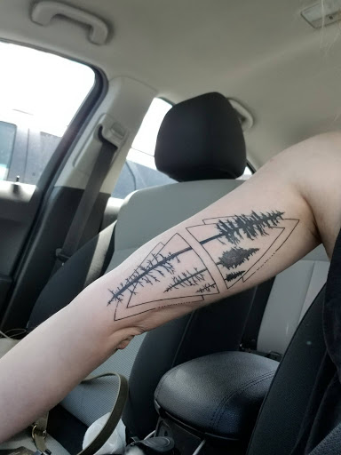 Explore lone wolf tattoo ideas, creative tattoo ideas in Sauk City, available at The Madison Tattoo Company