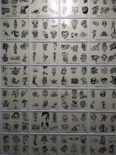 Explore blacked out tattoo ideas, creative tattoo ideas in Houston, available at The Neon Jackal Tattoo