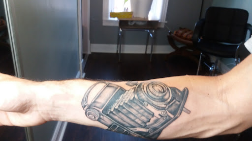 Explore small beach tattoo ideas, creative tattoo ideas in Troy, available at The Factory Tattoo