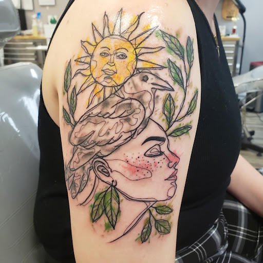 Find cardinal tattoo ideas for ladies for your next unique tattoo in Atlanta at Empyrean Tattoo Studio