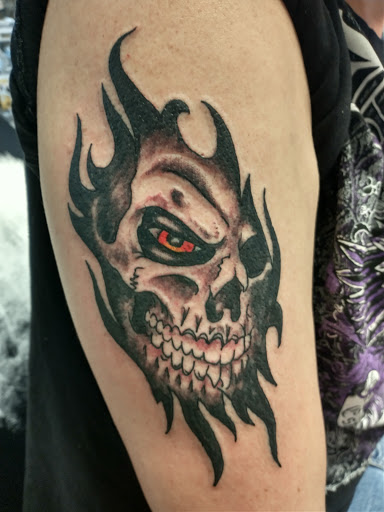 Find garter belt tattoo ideas for your next unique tattoo in Johnstown at Screaming Needle Tattoo & Body Piercing