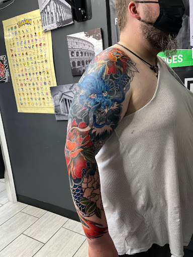 Explore butterfly spine tattoo ideas, creative tattoo ideas in Cadillac, available at Limitless Ink Tattoo Studio