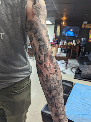 Explore hand print tattoo ideas, creative tattoo ideas in Pittsburgh, available at Crimson Lotus Collective