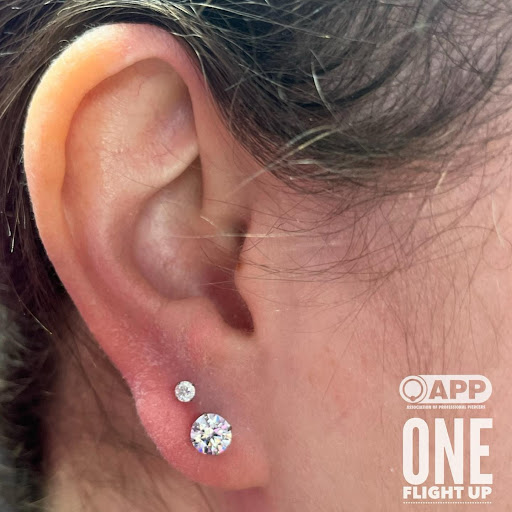 Explore last name back tattoo ideas, creative tattoo ideas in Plattsburgh, available at One Flight Up Body Piercing