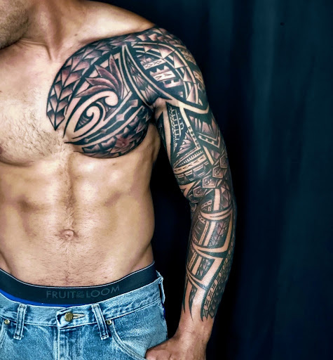 Explore floral arm tattoo ideas, creative tattoo ideas in Debary, available at Divine Line Tattoos