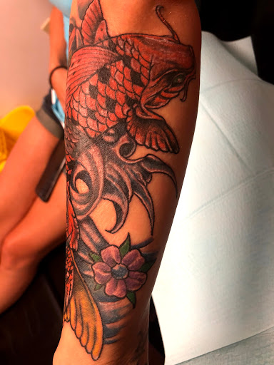 Explore small flowers tattoo ideas, creative tattoo ideas in Seymour, available at American Gypsy Tattoo Corp.