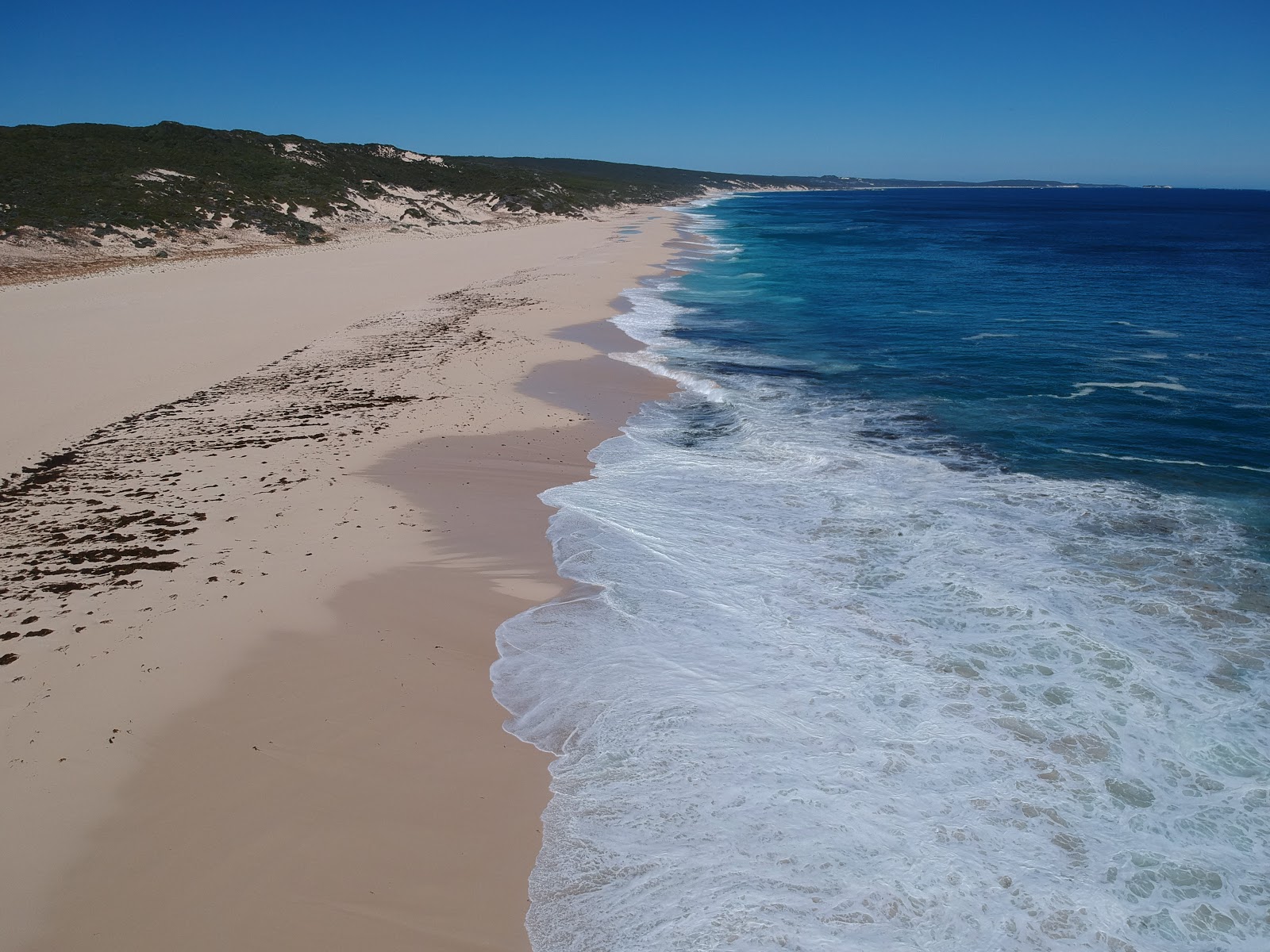 Foto von South Beach mit feiner weißer sand Oberfläche