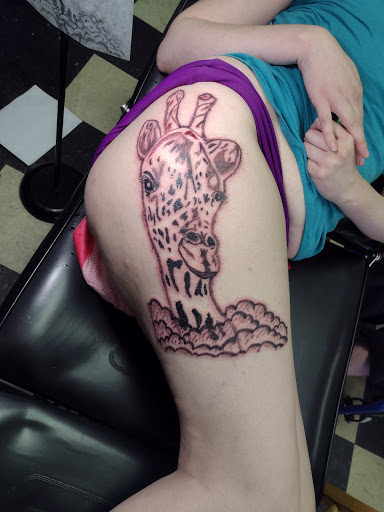 Explore tattoos for behind the ear ideas, creative tattoo ideas in Owosso, available at Twisted ink tattoo