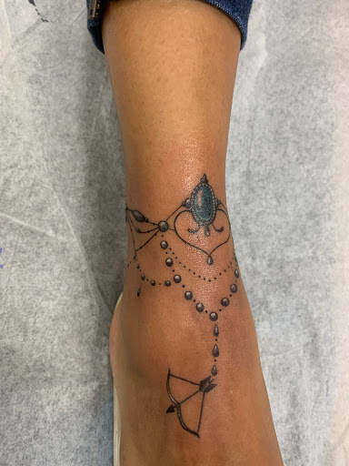 Explore rose and butterfly tattoo ideas, creative tattoo ideas in Tampa, available at Angel Tattoo