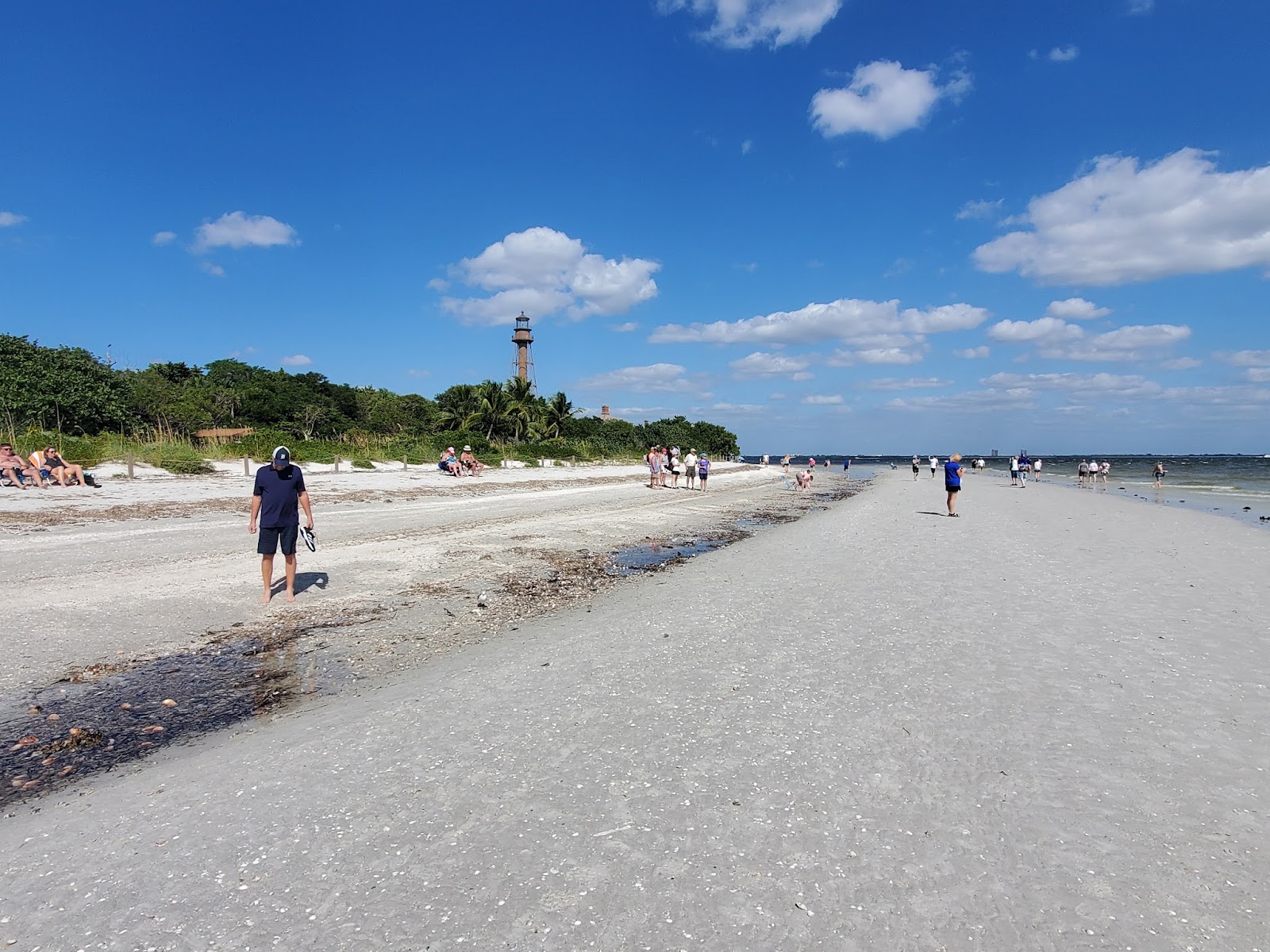 Fotografija Lighthouse beach z svetel pesek površino