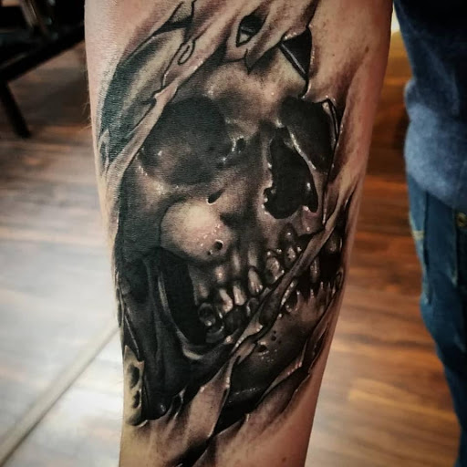 Explore black ink tattoo ideas, creative tattoo ideas in Lakeland, available at Black Swan Tattoo