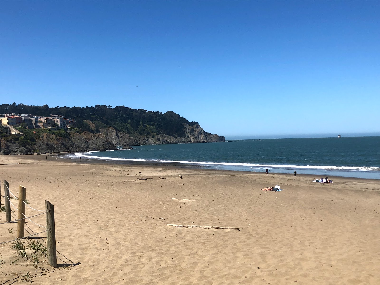 Fotografie cu Baker Beach cu o suprafață de apa turcoaz