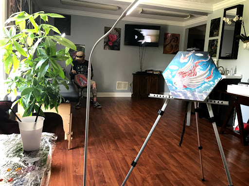 Explore colorful flower tattoo ideas, creative tattoo ideas in Girard, available at Empress Tattoos FKA Treehouse Tattoo