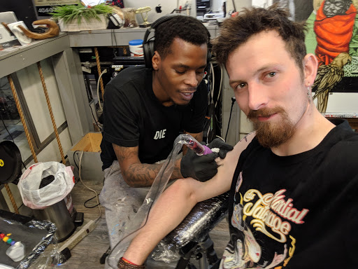 Explore tombstone tattoo ideas, creative tattoo ideas in Atlanta, available at Iron Palm Tattoos & Body Piercing Atlanta