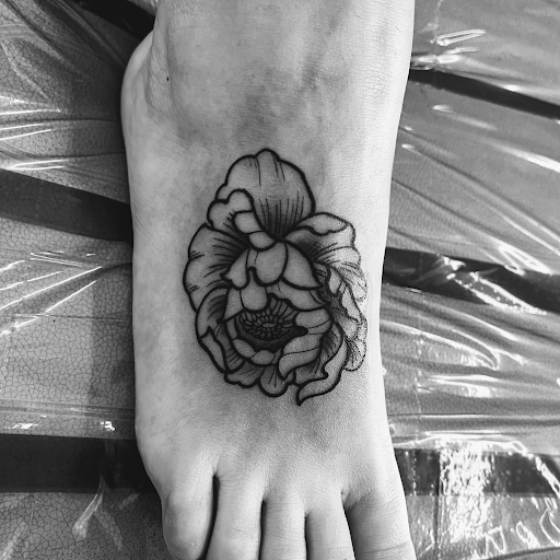 Explore angel neck tattoo ideas, creative tattoo ideas in Rogers, available at Ink Solutions Tattoo