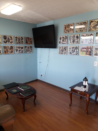 Explore black and white flower tattoo ideas, creative tattoo ideas in Calhoun, available at A Sailors Grave Tattoo Parlor