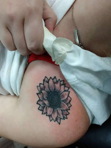 Explore neck tattoo ideas for men, creative tattoo ideas in Ozark, available at Tooth & Nail Tattoo & Piercing