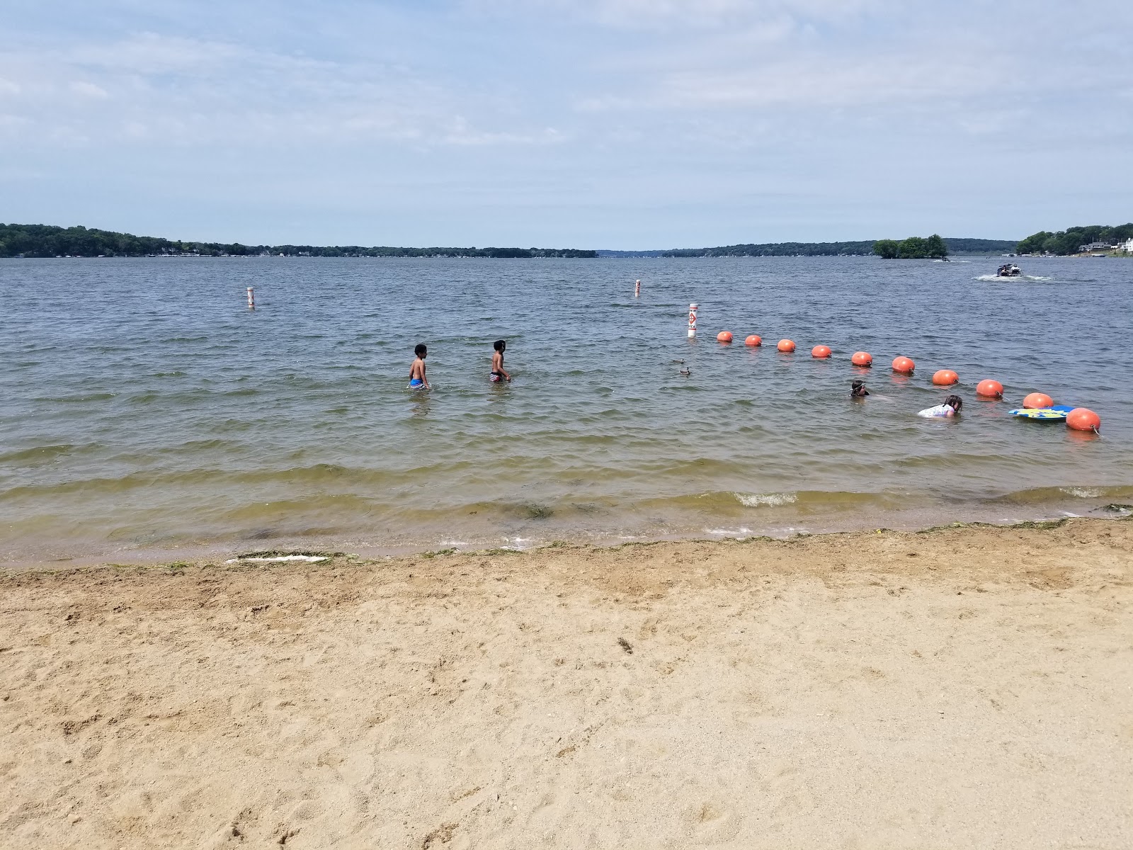 Photo of Pewaukee Beach with bright sand surface