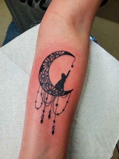 Explore single flower tattoo ideas, creative tattoo ideas in Elkin, available at Black Bear Tattoo