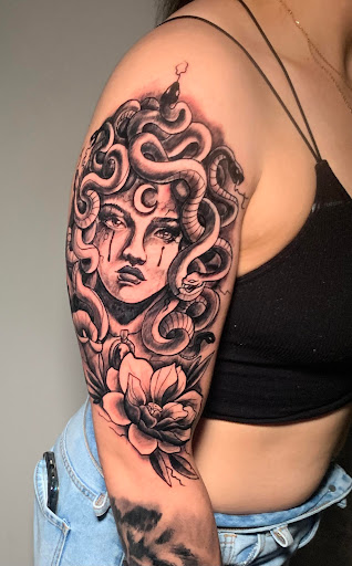 Explore tattoo ideas for women in arm, creative tattoo ideas in Atlanta, available at Iron Palm Tattoos & Body Piercing Atlanta