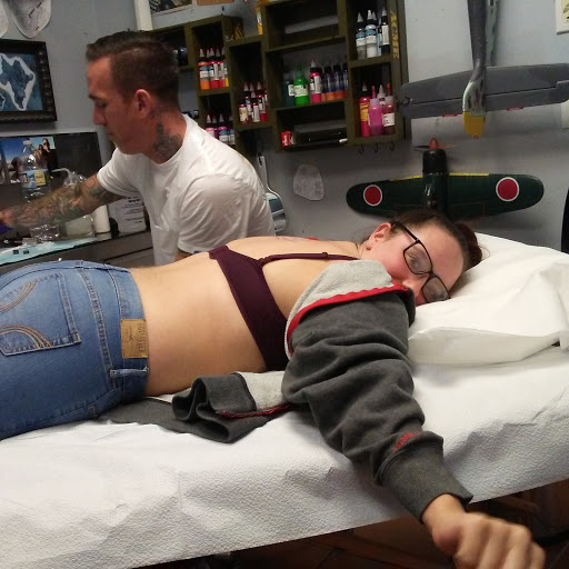 Explore tribal bear tattoo ideas, creative tattoo ideas in Brick, available at Vision Tattoo