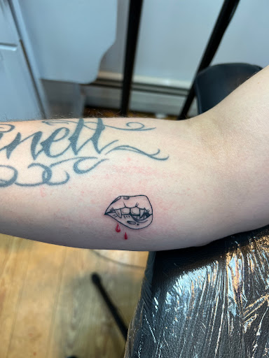 Explore fantasy book tattoo ideas, creative tattoo ideas in West Babylon, available at Bizzy Empire Tattoo